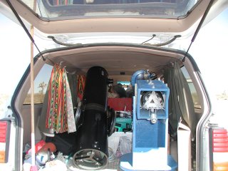 picture, telescopes loading in the car.