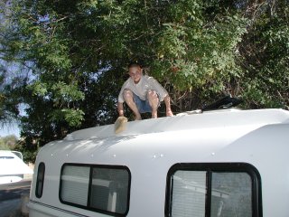 Matthew cleaning the trailer.