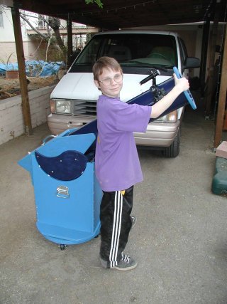 Picture of the little boy with his completed telescope.